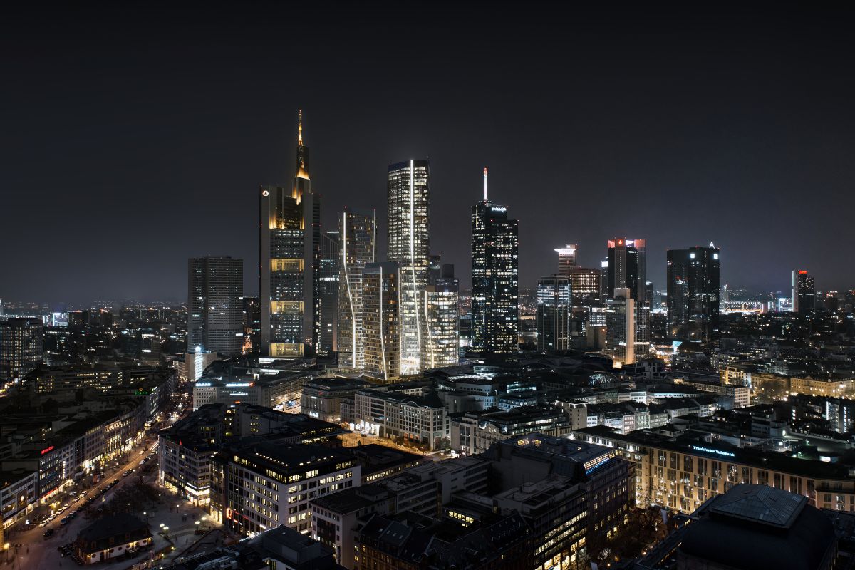 Sicht auf die Frankfurter Skyline mit dem neuen Quartier FOUR bei Nacht.